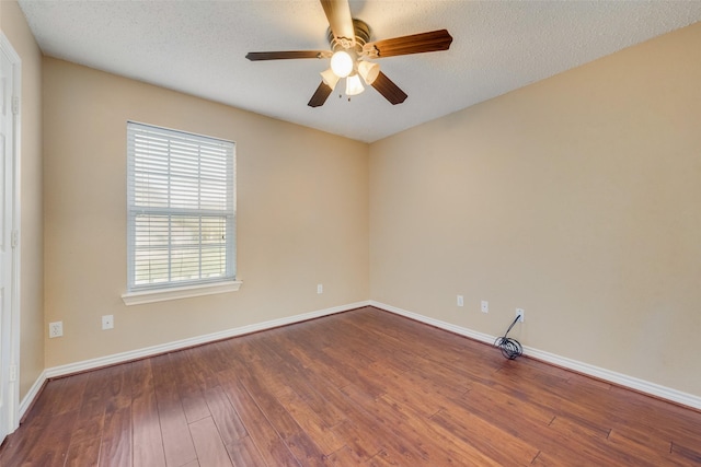 spare room featuring ceiling fan, hardwood / wood-style floors, and a textured ceiling