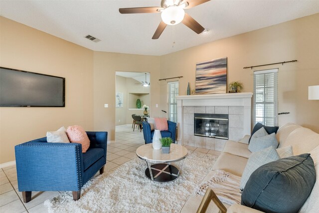 dining room with ceiling fan, light tile patterned floors, and vaulted ceiling