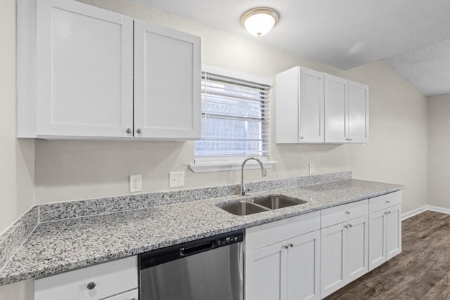 kitchen with sink, white cabinetry, a textured ceiling, stainless steel dishwasher, and light stone countertops