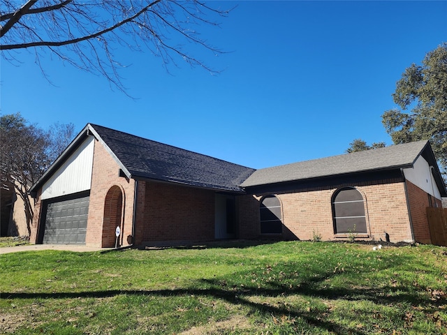 single story home with a garage and a front yard