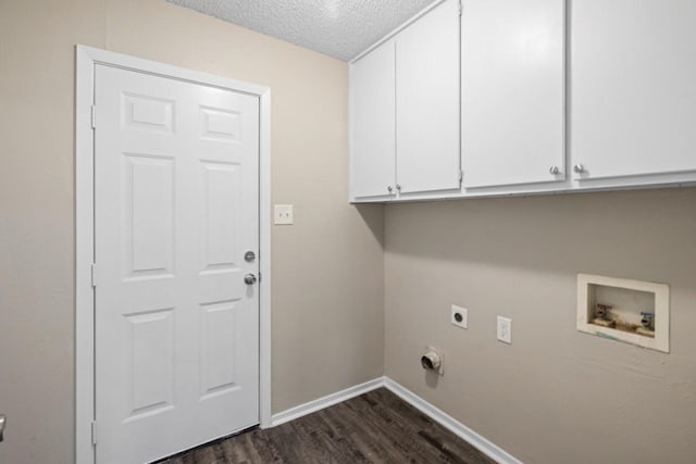 washroom featuring cabinets, a textured ceiling, dark hardwood / wood-style flooring, washer hookup, and hookup for an electric dryer