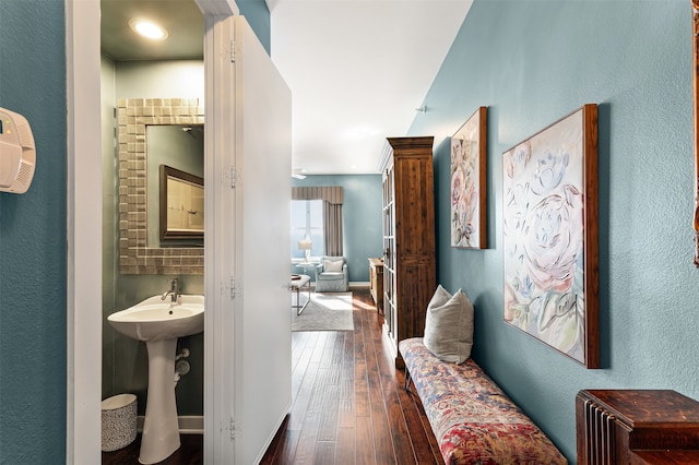 hallway with dark hardwood / wood-style floors