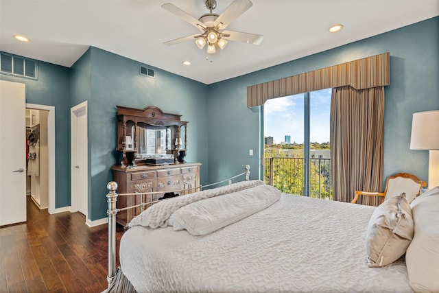 bedroom featuring dark wood-type flooring, ceiling fan, and access to outside