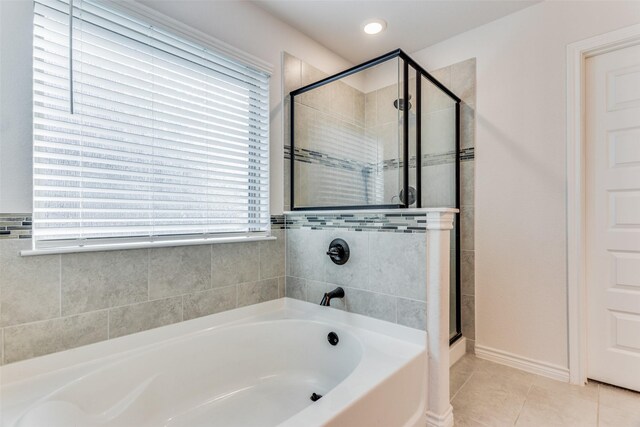 bathroom with tile patterned flooring and plus walk in shower