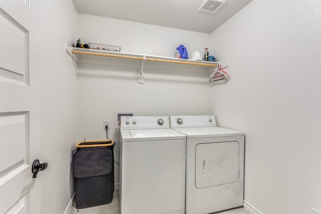 laundry room featuring washer and clothes dryer