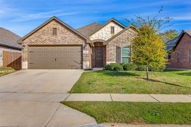 front of property with a garage and a front lawn