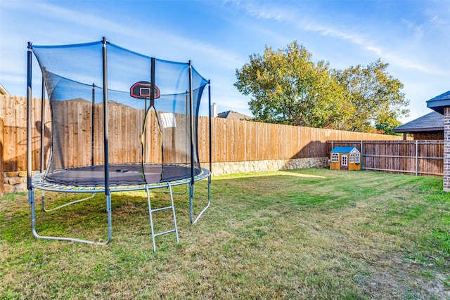 view of yard featuring a trampoline