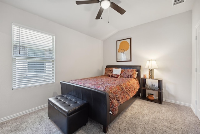 bedroom with ceiling fan, light carpet, and vaulted ceiling