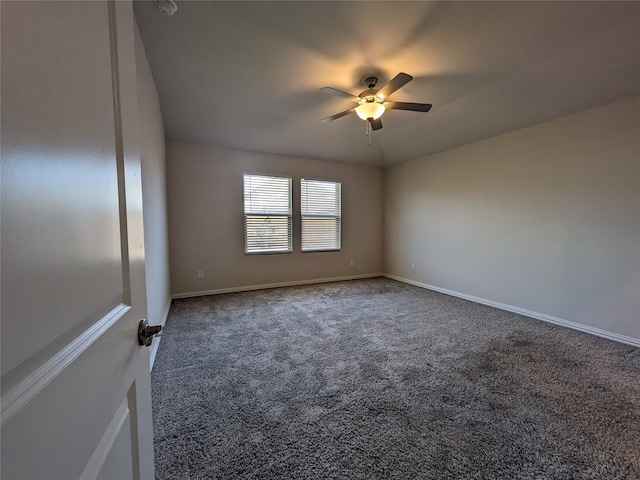 carpeted spare room with ceiling fan