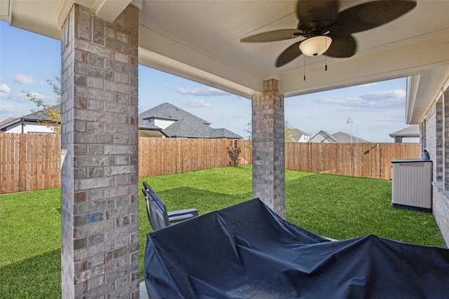 view of yard with ceiling fan