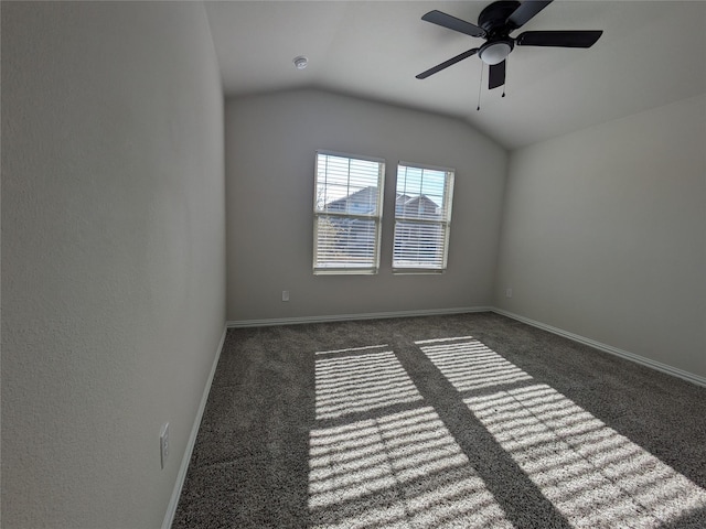 carpeted empty room with ceiling fan and lofted ceiling