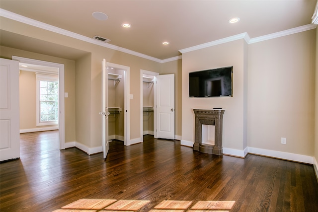 unfurnished living room with dark hardwood / wood-style flooring and ornamental molding