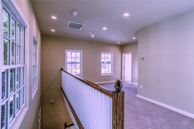 hallway with dark carpet