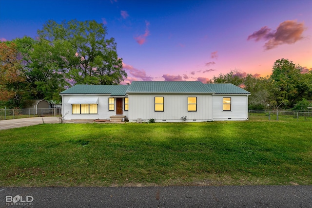 view of front of property with a yard