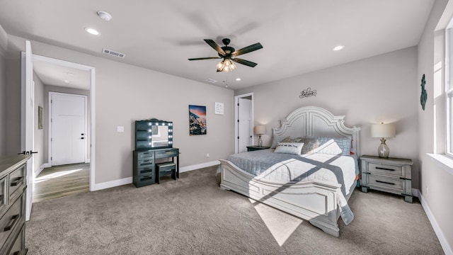 carpeted bedroom with ceiling fan