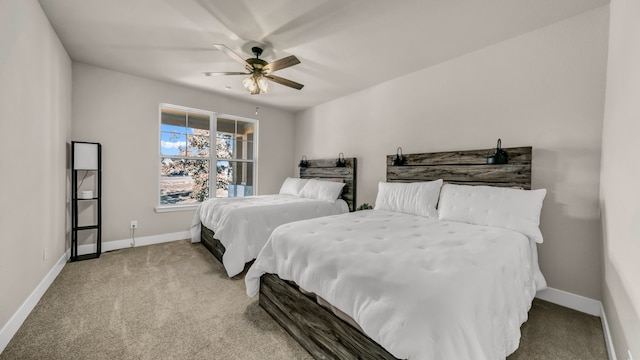 bedroom with ceiling fan and light carpet