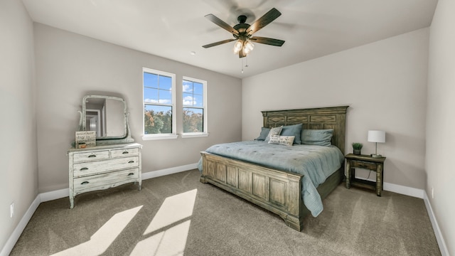 bedroom with ceiling fan and dark carpet