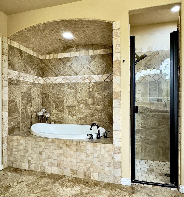 bathroom with shower with separate bathtub