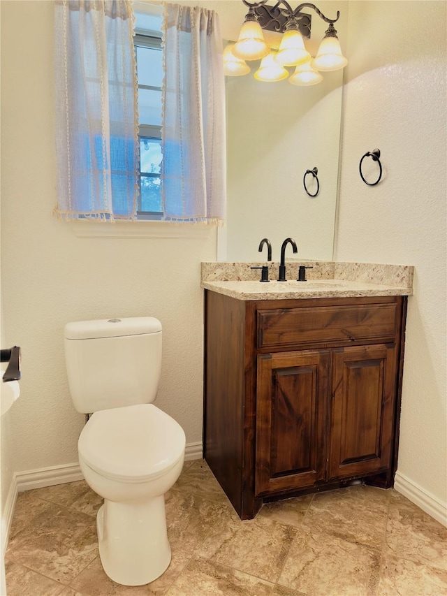 3390 Zion Hill Rd, Weatherford, TX 76088 - bathroom with vanity, toilet, and baseboards