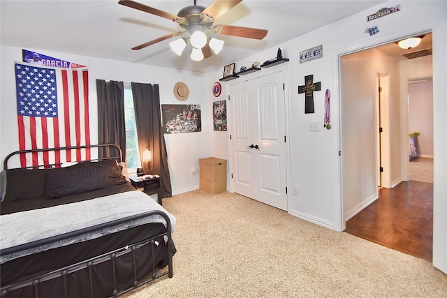 carpeted bedroom with ceiling fan