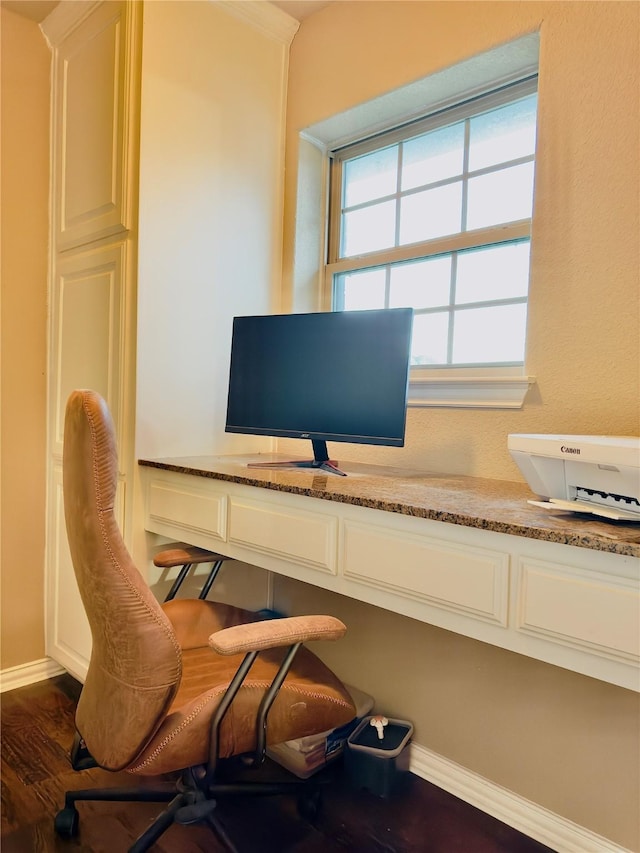 home office with dark hardwood / wood-style floors