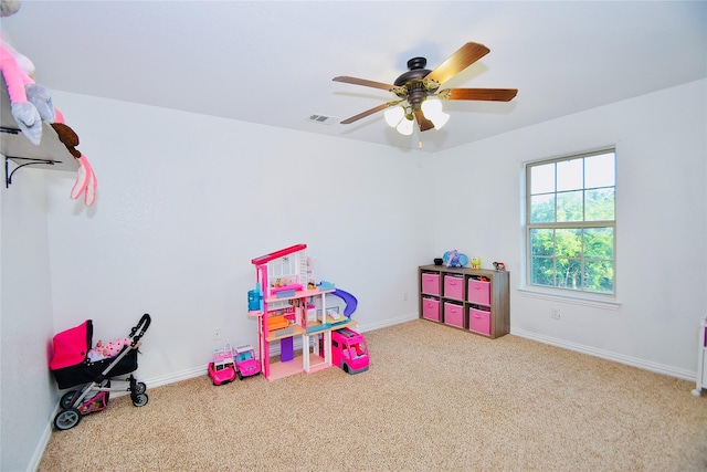 recreation room featuring ceiling fan and light colored carpet