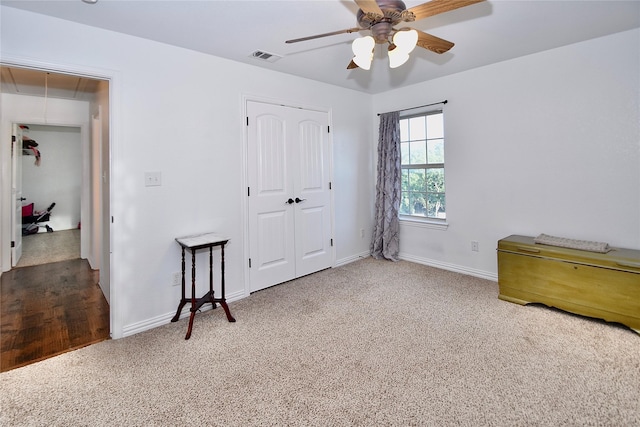 bedroom with ceiling fan, a closet, and carpet