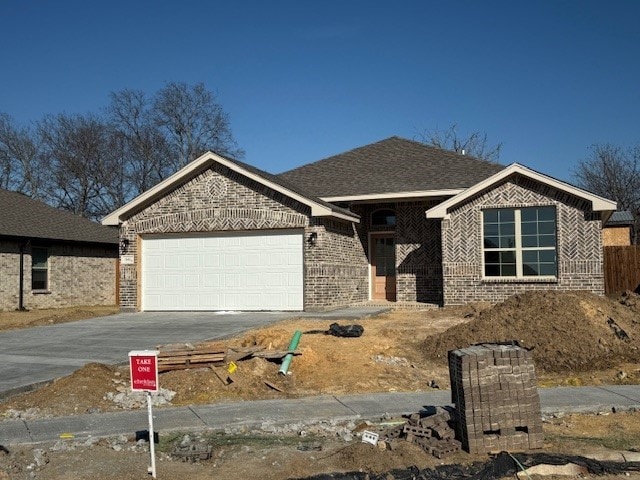 view of front of property with a garage