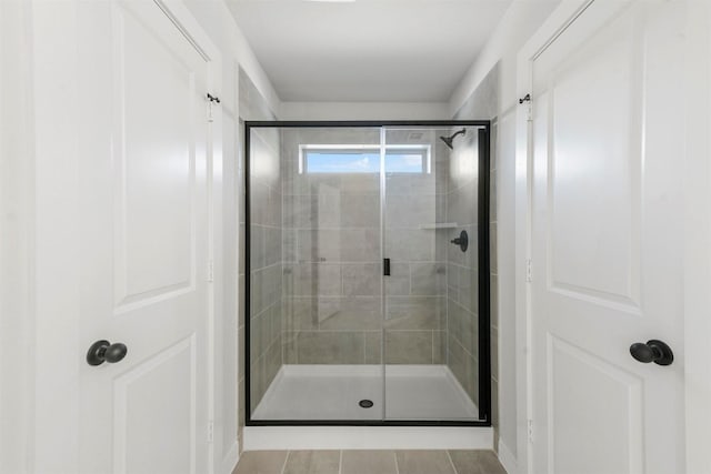 full bath with a shower stall