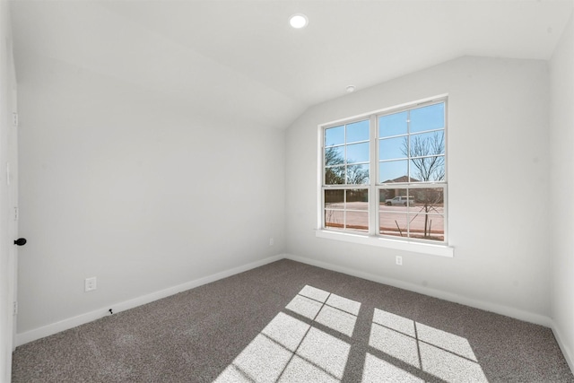 bonus room with lofted ceiling, baseboards, and carpet floors