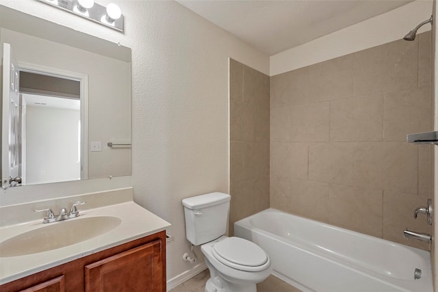 full bathroom with tiled shower / bath combo, vanity, and toilet