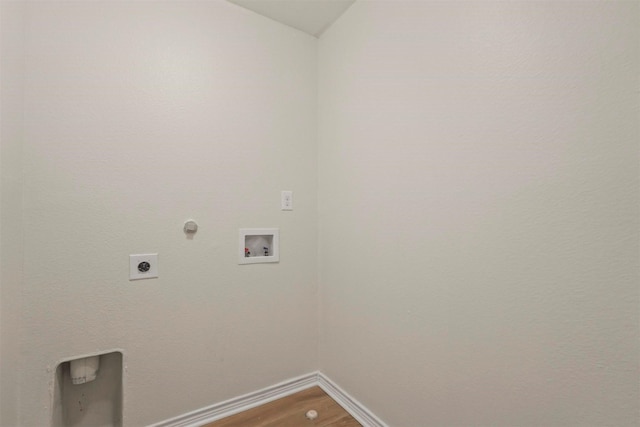 laundry area with gas dryer hookup, hookup for an electric dryer, hookup for a washing machine, and hardwood / wood-style floors