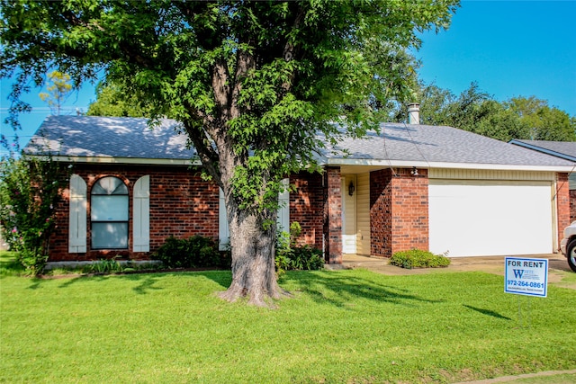 ranch-style home with a front lawn and a garage