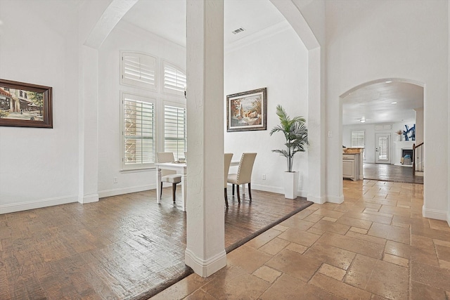 dining area with a high ceiling and plenty of natural light