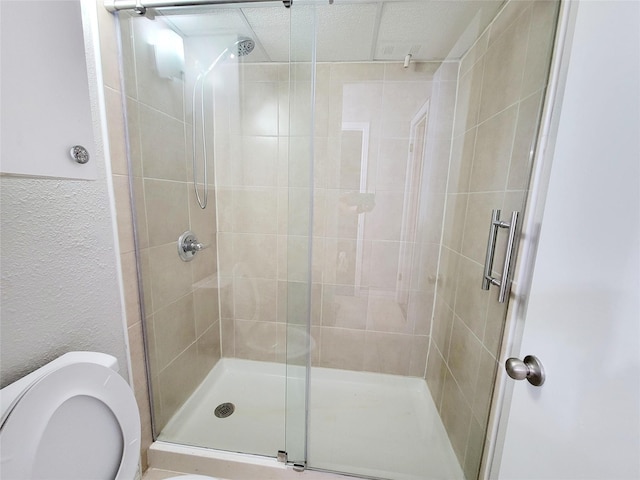 bathroom with tile patterned flooring, vanity, toilet, and walk in shower