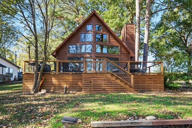 rear view of house with a wooden deck