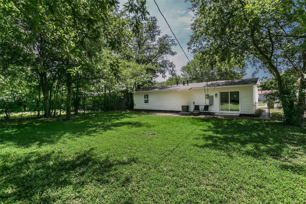 rear view of house with a lawn