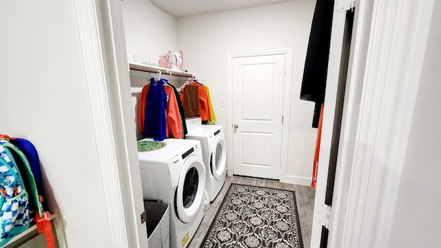 laundry area featuring washing machine and clothes dryer