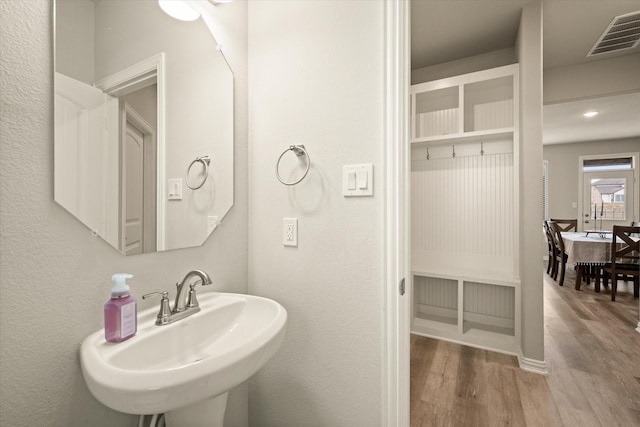 bathroom featuring sink and hardwood / wood-style flooring