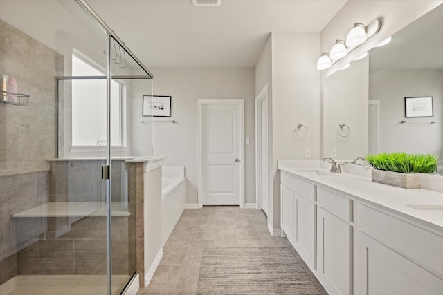 bathroom featuring tile patterned floors, independent shower and bath, and vanity