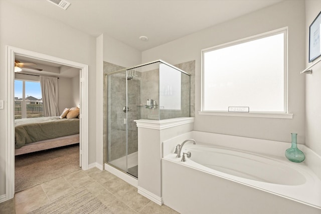 bathroom featuring tile patterned floors, ceiling fan, and independent shower and bath