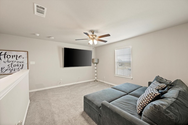 living room featuring ceiling fan and carpet flooring