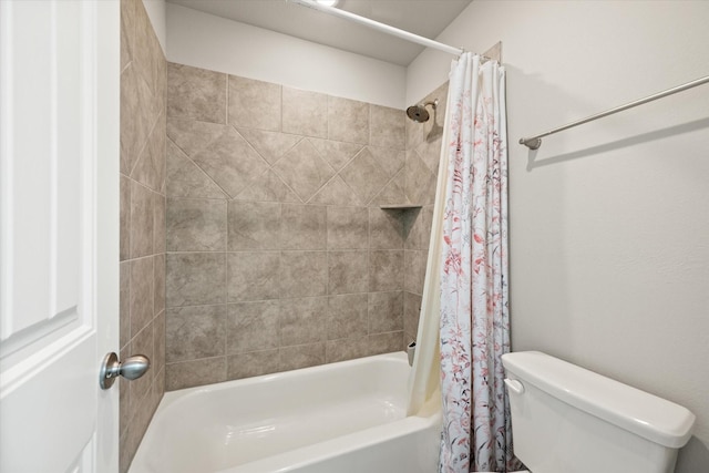 bathroom with shower / bathtub combination with curtain and toilet