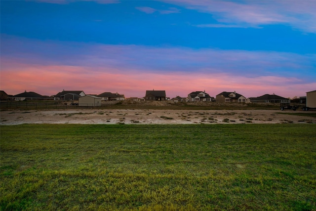 view of yard at dusk