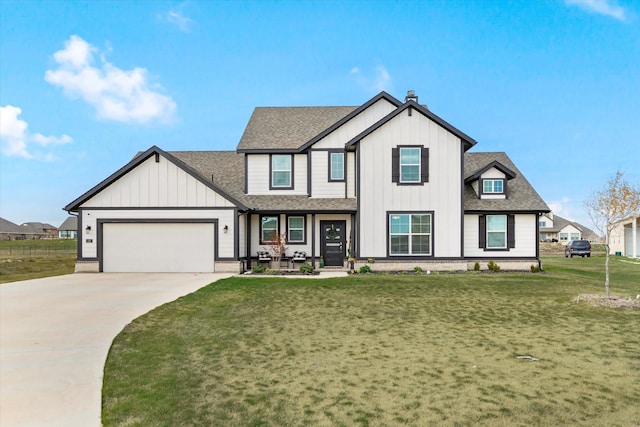 view of front of home featuring a front lawn and a garage