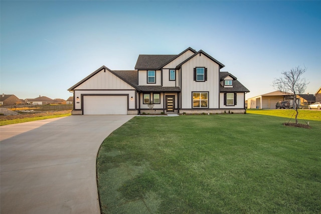 view of front of property featuring a garage and a front yard