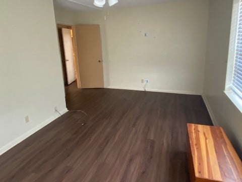 spare room featuring dark hardwood / wood-style flooring