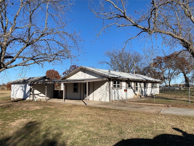 back of house featuring a yard and a patio area