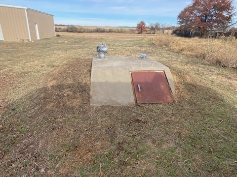 entry to storm shelter with a yard