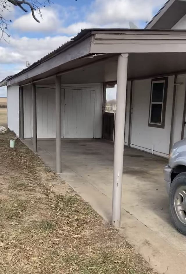 exterior space with a carport